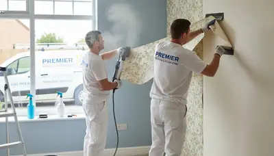 Wallpaper removal service in Portland, OR by Portland Paint Pros prepping walls for painting